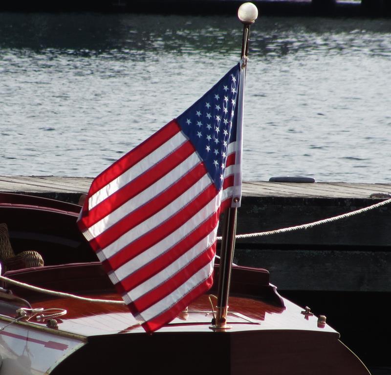 Flag with antique wooden boat
